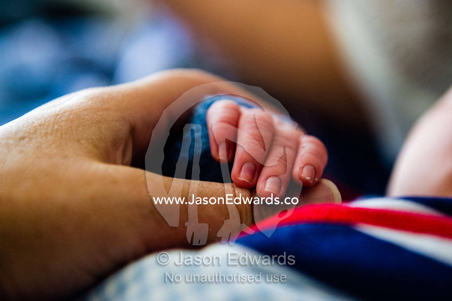 The tiny fingers of a small baby wrapped in a bundle. Cooranbong, New South Wales, Australia.