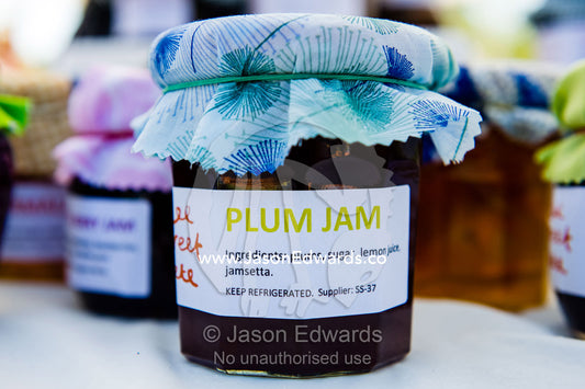 Homemade plum jam for sale at an elementary school fete. Carlton North, Melbourne, Victoria, Australia.