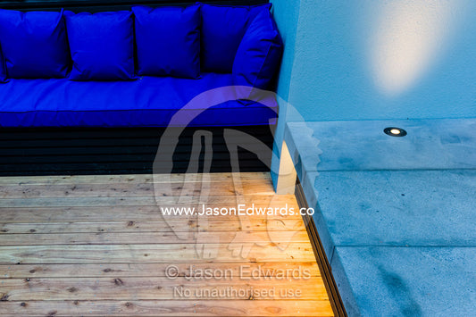 An architecturally designed outdoor patio and sofa setting with spotlights at a garden show. Melbourne International Flower and Garden Show, Carlton Gardens, Carlton, Melbourne, Victoria, Australia.