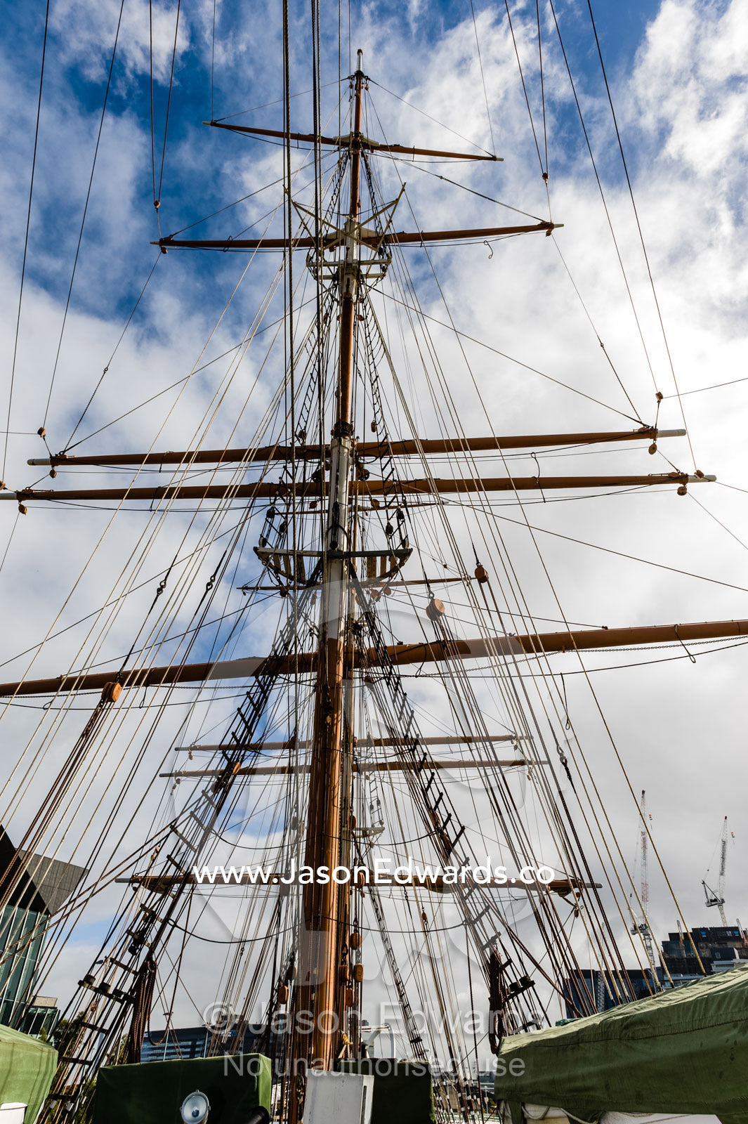 The complicated masts, booms and rigging of an antique sailing ship museum. Polly Woodside, South Wharf Precinct, Yarra River, Melbourne, Victoria, Australia.