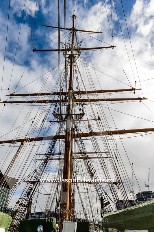 The complicated masts, booms and rigging of an antique sailing ship museum. Polly Woodside, South Wharf Precinct, Yarra River, Melbourne, Victoria, Australia.