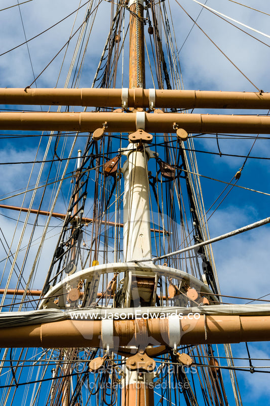 The complicated masts, booms and rigging of an antique sailing ship museum. Polly Woodside, South Wharf Precinct, Yarra River, Melbourne, Victoria, Australia.