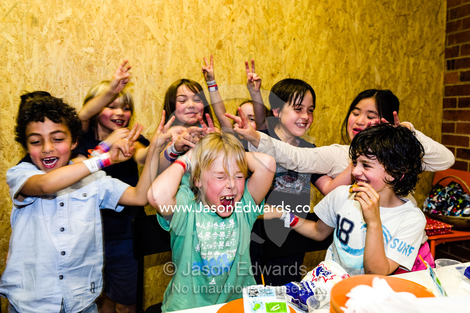 A group of friends play games with a birthday boy at his party. Carlton North, Melbourne, Victoria, Australia.
