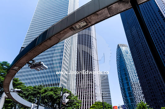 A monorail runs between office towers in the central business district. Shinjuku, Tokyo, Japan.