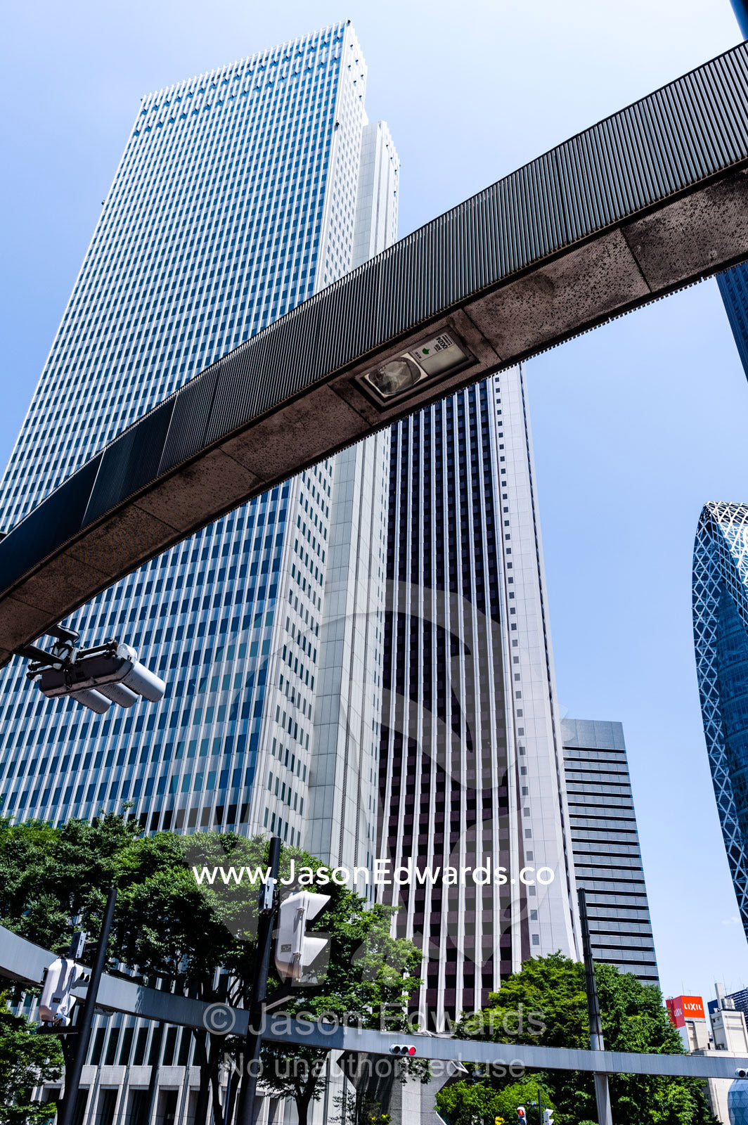 A monorail runs between office towers in the central business district. Shinjuku, Tokyo, Japan.
