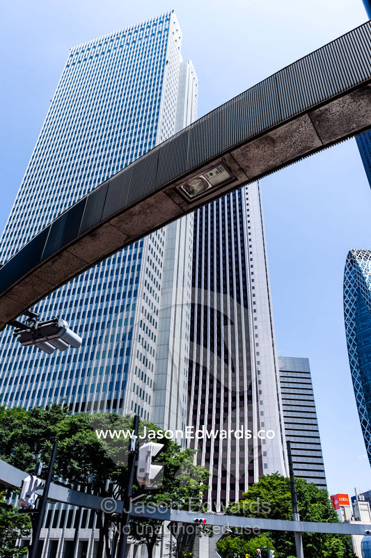 A monorail runs between office towers in the central business district. Shinjuku, Tokyo, Japan.