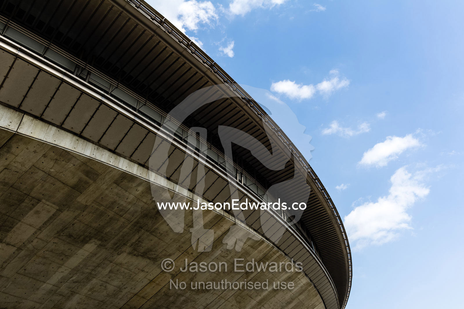 The curved concrete spaceship-like facade of the Tokyo Metropolitan Gymnasium. Tokyo Metropolitan Gymnasium, Sendagaya, Shibuya, Tokyo, Japan.