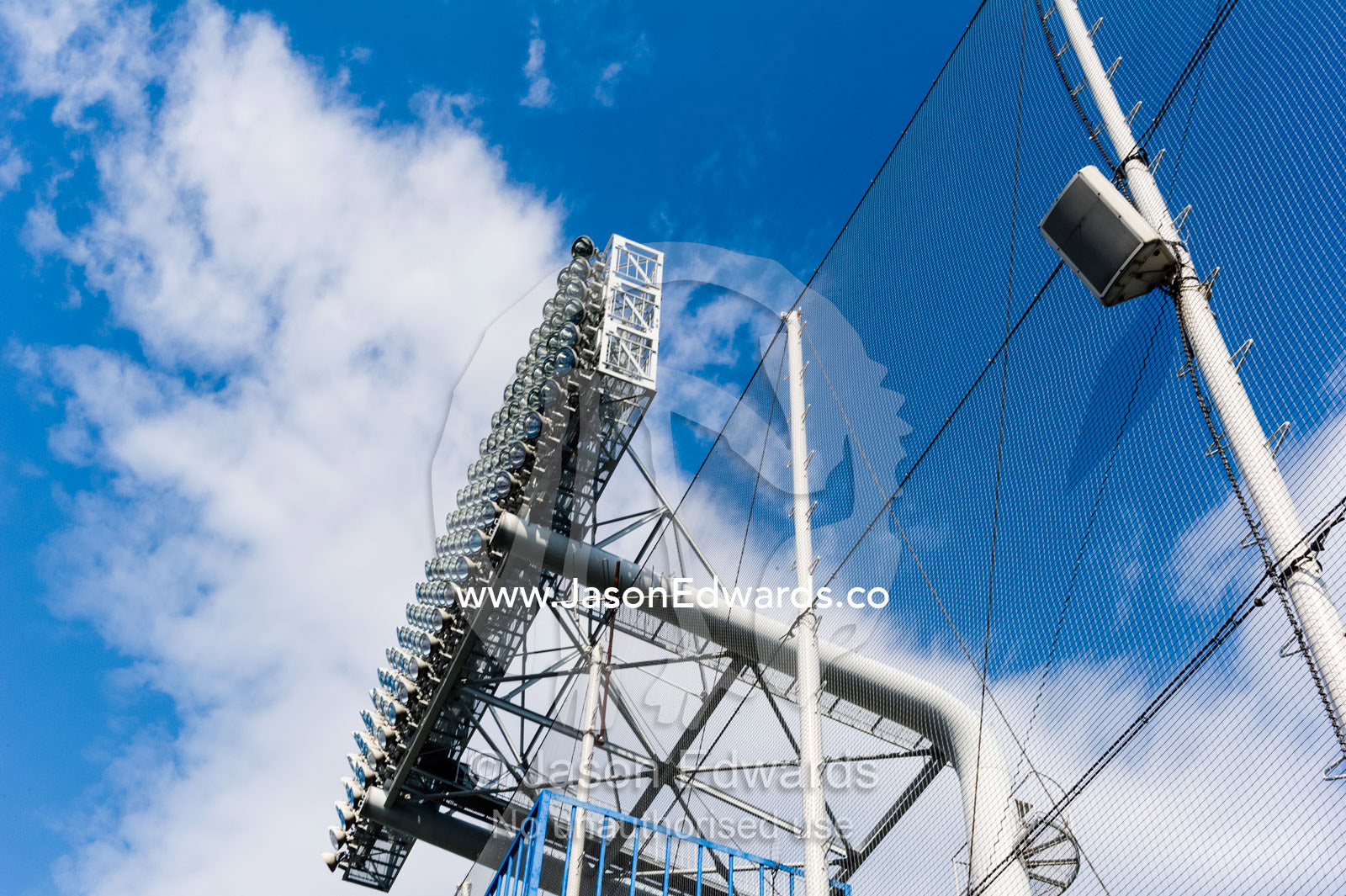 A large lighting structure above a baseball stadium in Tokyo. Meiji Jingu Stadium, Tokyo, Japan.