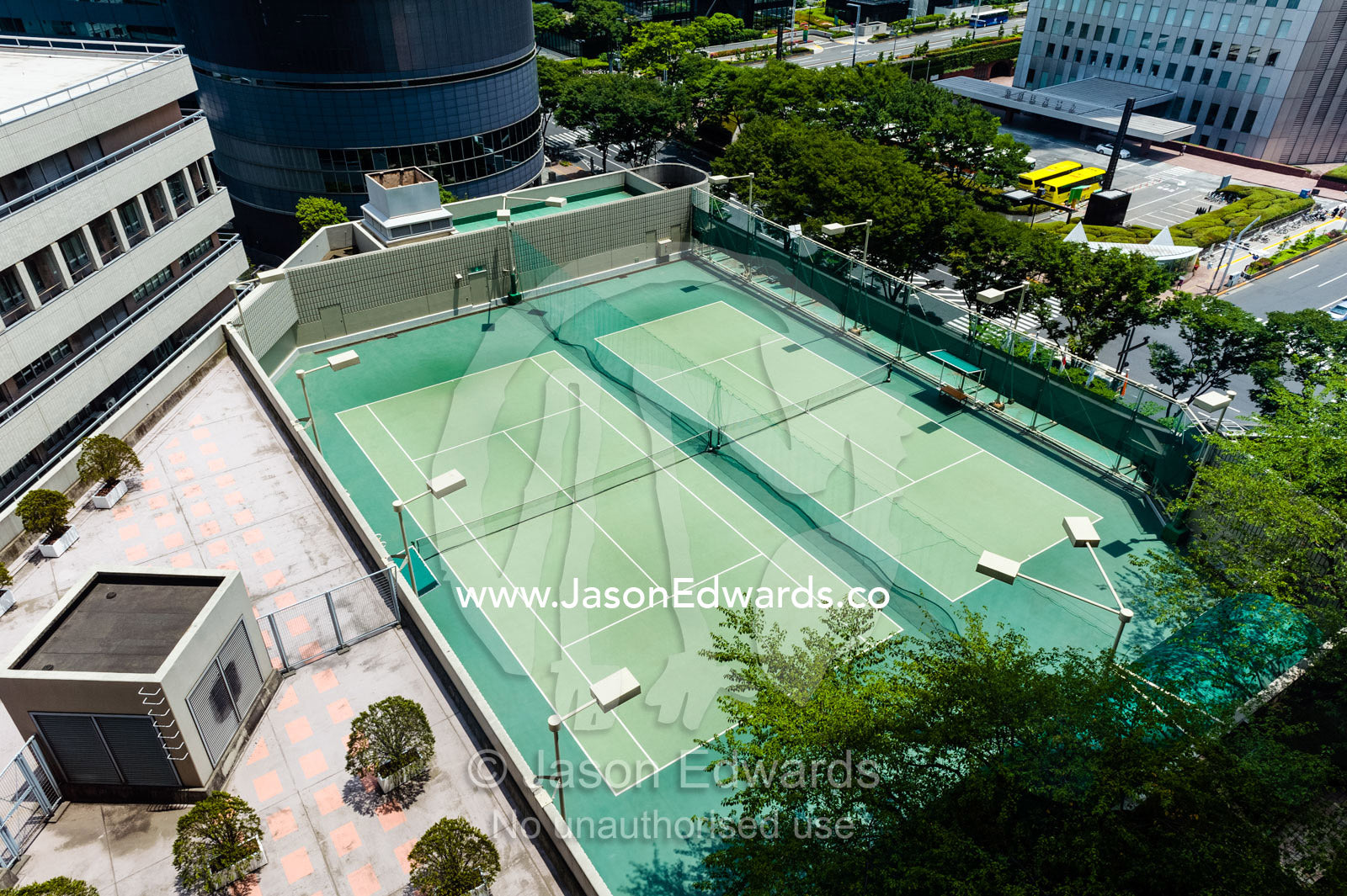 An inner city tennis court in a hotel apartment complex. Shinjuku, Tokyo, Japan.