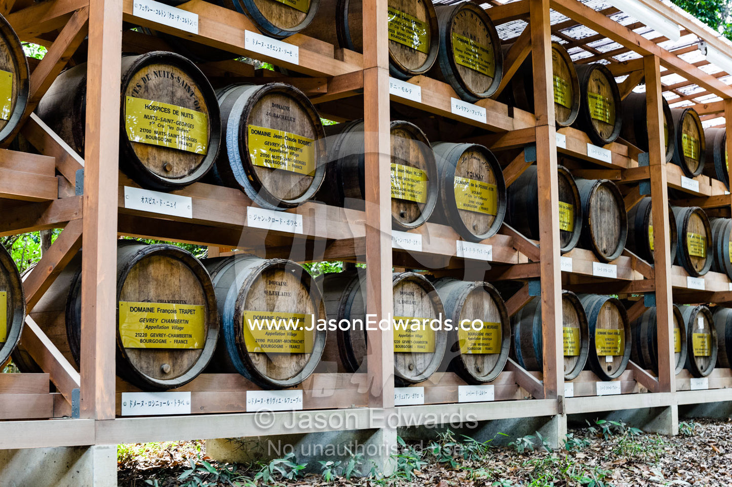 Rows of wine barrels presented as gifts to the temple from French vineyards. Meiji Shrine, Shinto Shrine, Shibuya, Tokyo, Japan.