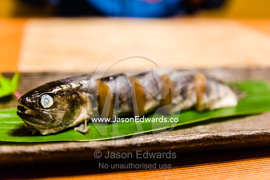 A river fish called Ayu stuffed with rice is called Ayu Mesi served at Kaiseki, a traditional multi-course Japanese dinner. Unryu Onsen, Izu Peninsula, Shizuoka Prefecture, Japan.