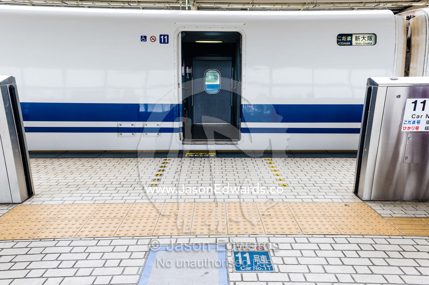A Skinkansen or Japanese bullet Train at a railway platform. Okayama Station, Okayama, Okayama Prefecture, Japan.