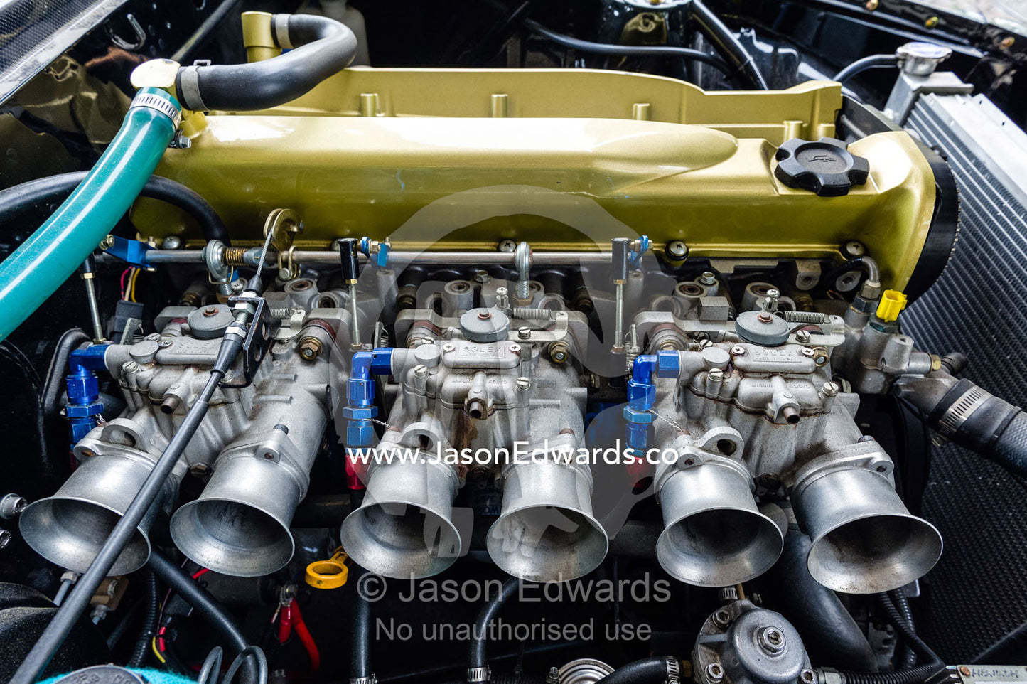 A Datsun 240Z with a RB26 engine with side-draft solex carburettors and gold rocker cover. Rocky Auto, Nagoya, Chubu Region, Japan.