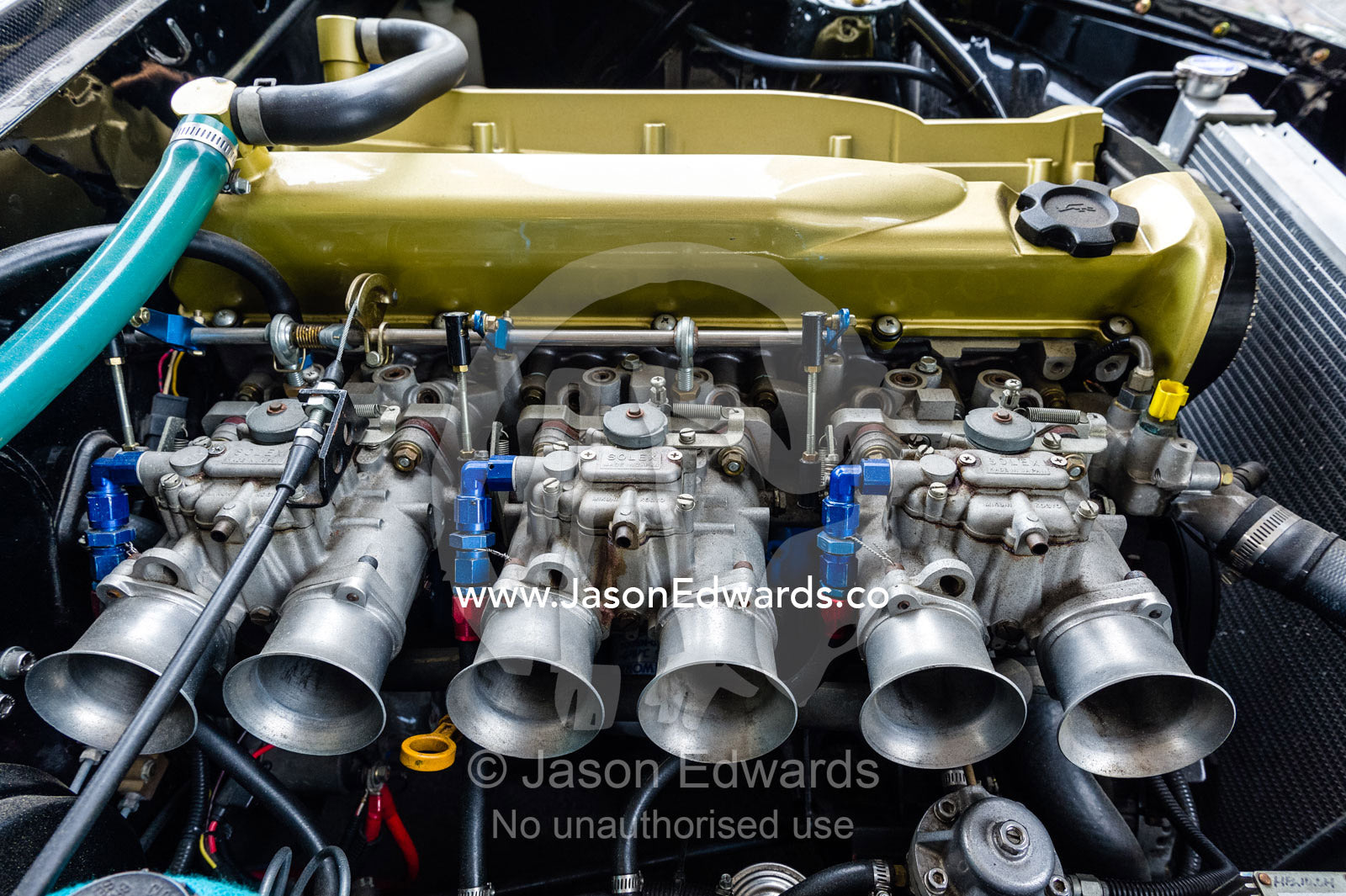 A Datsun 240Z with a RB26 engine with side-draft solex carburettors and gold rocker cover. Rocky Auto, Nagoya, Chubu Region, Japan.