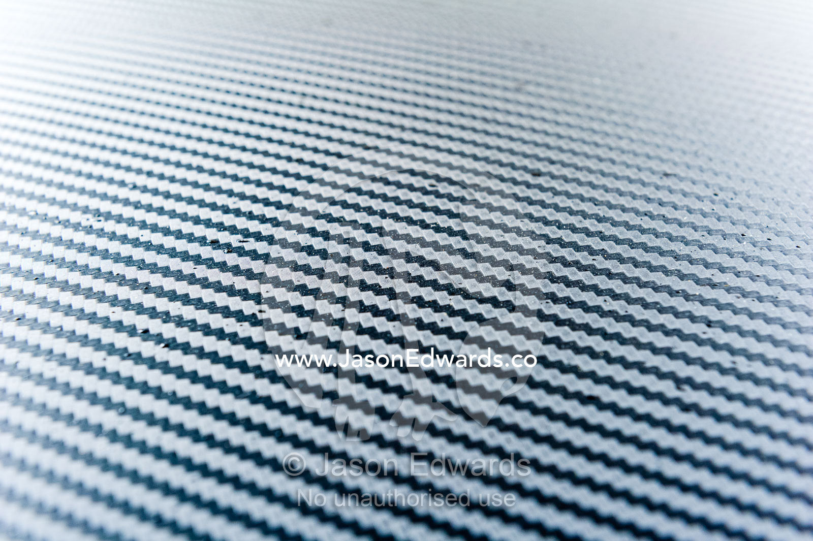 A close-up detail of a carbon fiber panel on a Datsun 240Z. Rocky Auto, Nagoya, Chubu Region, Japan.