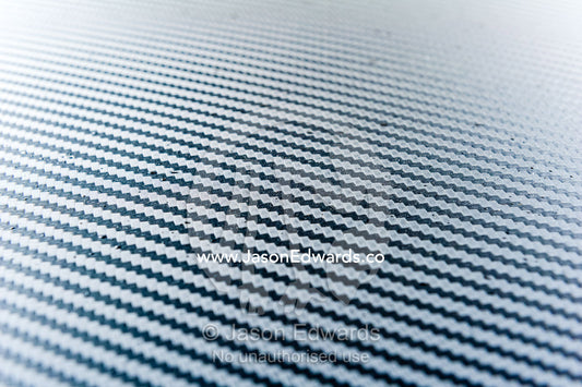 A close-up detail of a carbon fiber panel on a Datsun 240Z. Rocky Auto, Nagoya, Chubu Region, Japan.