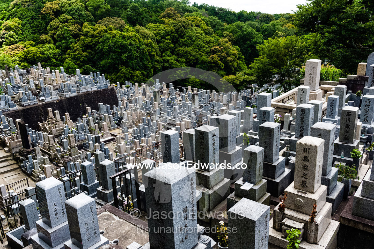 A graveyard full of tombstones near a temple in Japan. Otani Honbyo Mausoleum, Kyoto, Japan.
