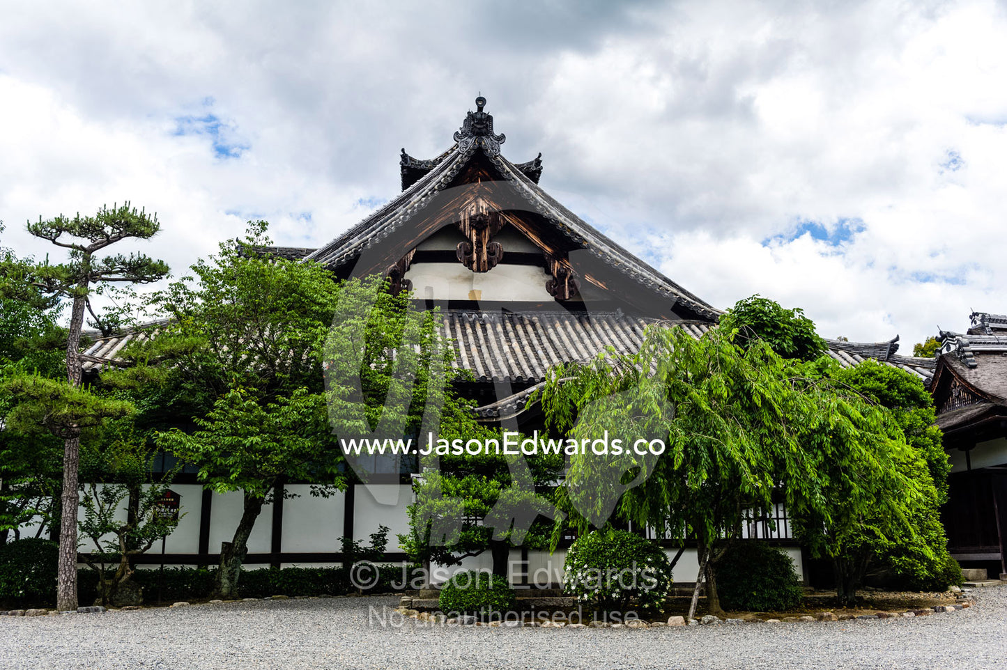 The weathered timber and tree-lined facade of the Myoho-in Temple in Kyoto. Myoho-in Temple, Higashiyama Ward, Kyoto, Kyoto Prefecture, Japan.