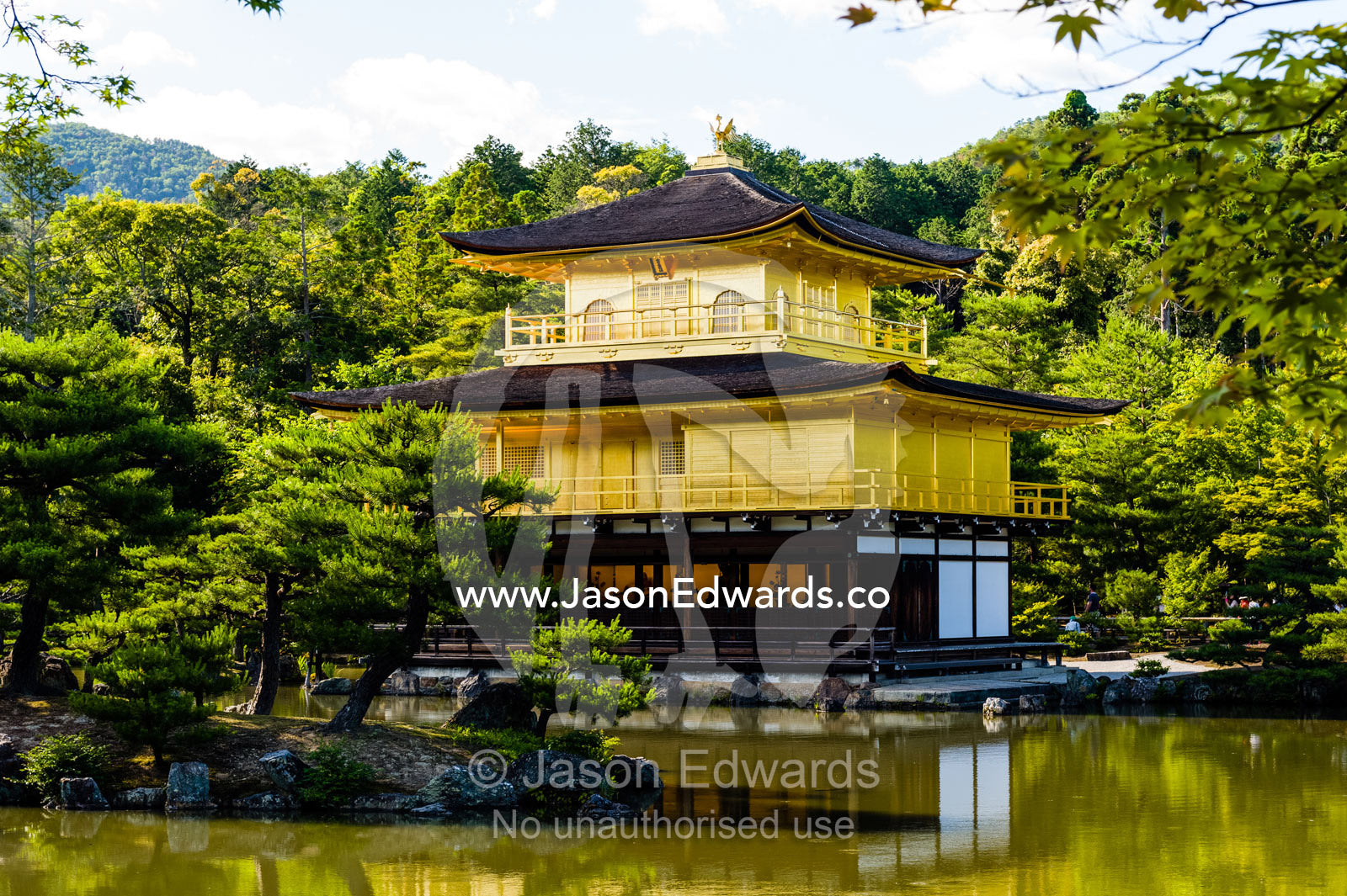The Temple of the Golden Pavilion on the shore of an ornamental lake. Temple of the Golden Pavilion, Kinkaku-ji, Kyoto, Japan.