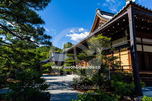 A path between ancient temples near the Temple of the Golden Pavilion. Temple of the Golden Pavilion, Kinkaku-ji, Kyoto, Japan.