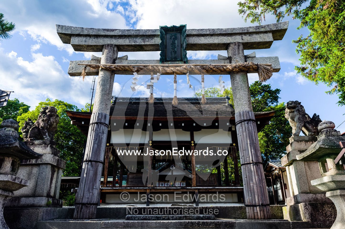 A torii gate at the entrance to a Shinto shrine in a small Japanese village. Kyoto, Japan.