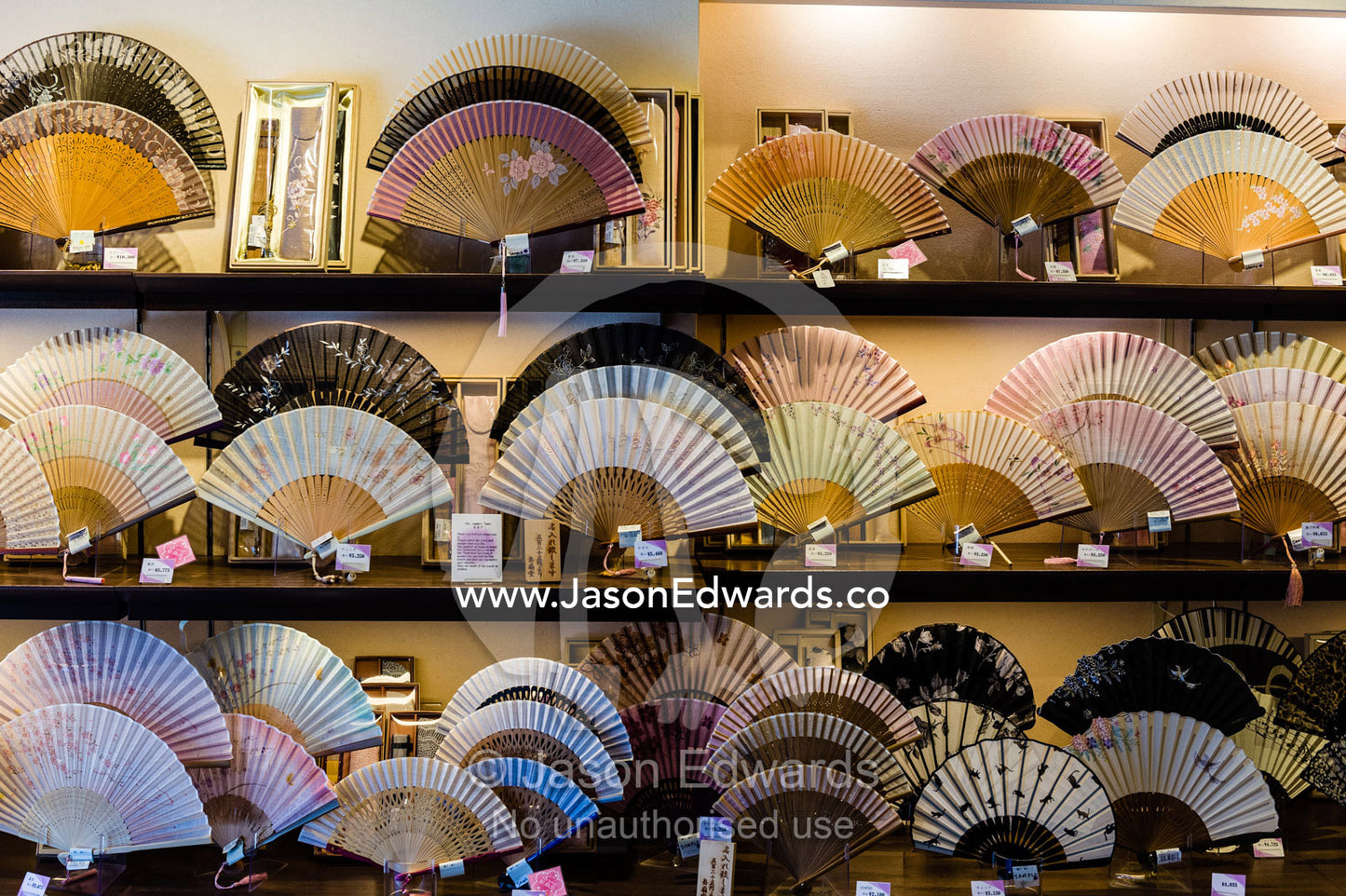 A shop near a temple sells delicate traditionally decorated Japanese fans. Yasaka Pagoda, Hokanji Temple, Higashiyama, Kyoto, Japan.