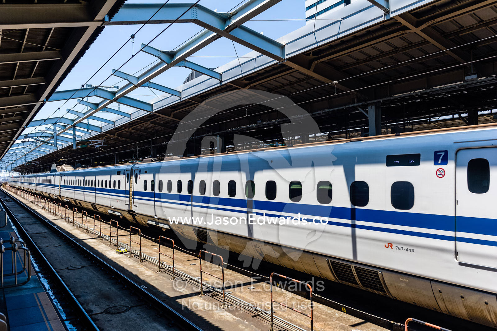 Train carriages lined against a railway platform. Shinjuku Station, Shinjuku, Tokyo, Japan.