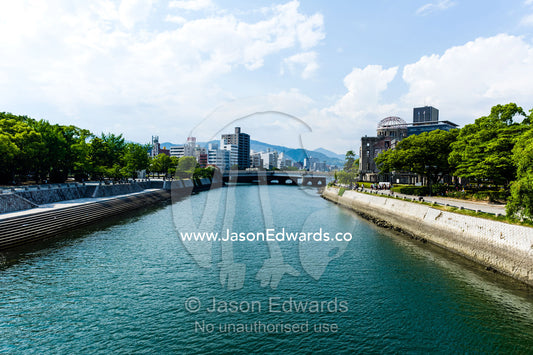 The ruin of the Hiroshima Prefectural Industrial Promotion Hall known as the Atomic Bomb Dome or Genbaku Dōmu. Ota River, Aioi Bridge, Hiroshima Peace Memorial Park, Hiroshima, Honshu Island, Japan.