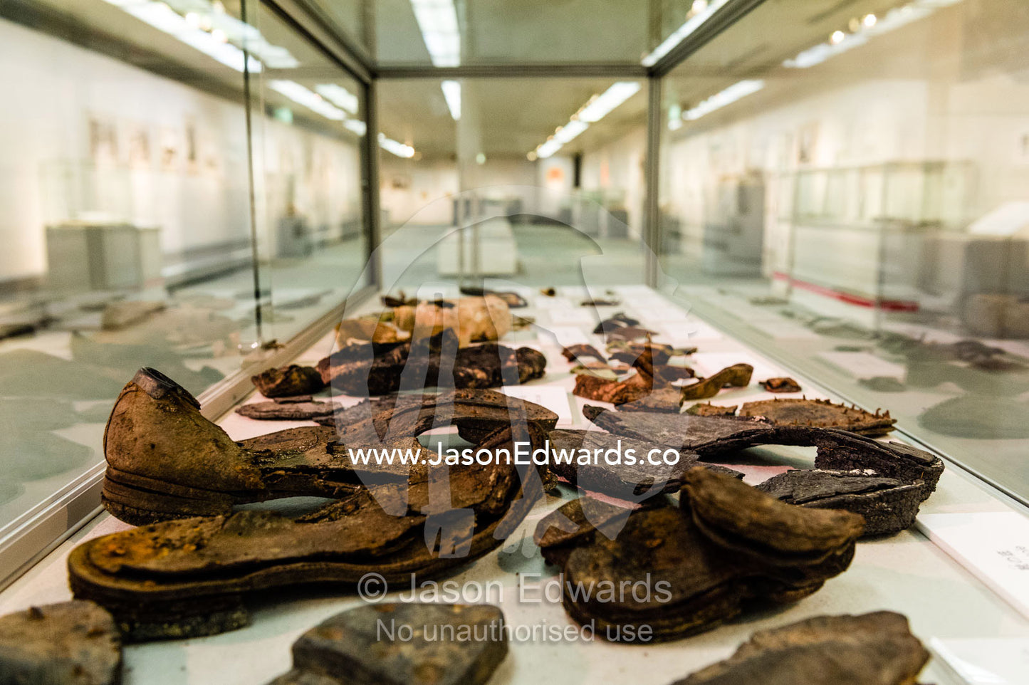 A collection of shoes damaged during the atomic bomb blast over Hiroshima. Hiroshima Peace Memorial Museum, Hiroshima Peace Memorial Park, Hiroshima, Honshu Island, Japan.