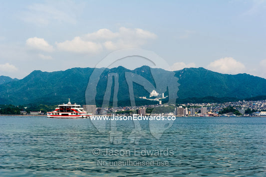 A passenger ferry transporting tourists from the mainland to an island. Miyajima, Itsukushima Island, Inland Sea of Japan, Hiroshima Bay, Japan.