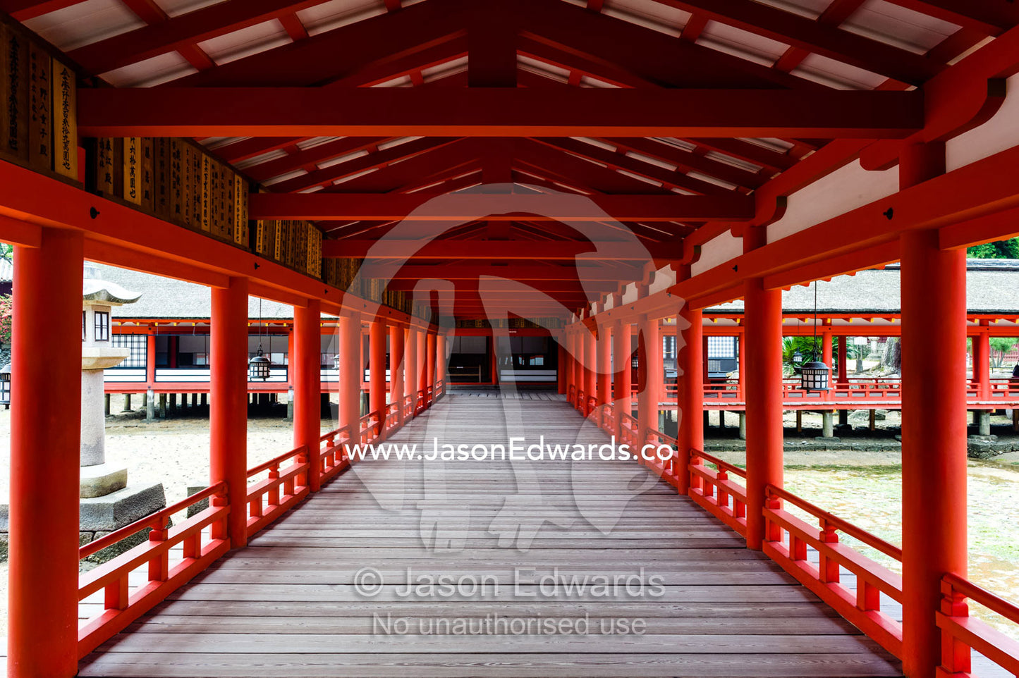 The red columns and boardwalks of the Itsukushima Shrine walk out over the ocean. Itsukushima Shrine, Miyajima, Itsukushima Island, Inland Sea of Japan, Hiroshima Bay, Japan.