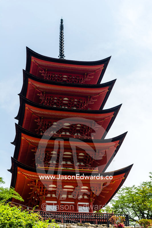 A towering red five-tiered pagoda at the Itsukushima Shrine. Toyokuni Shrine, Itsukushima Shrine, Miyajima, Itsukushima Island, Inland Sea of Japan, Hiroshima Bay, Japan.