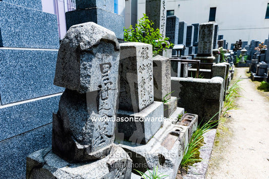A small cemetery adjacent to the Atomic Bomb Dome where the stone on the tombstones was fused by the blast. Hiroshima Peace Memorial Park, Hiroshima, Honshu Island, Japan.