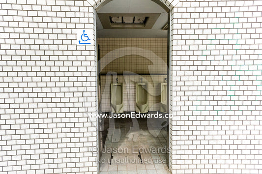 The open doorway to a public urinal in Japan. Hiroshima Peace Memorial Park, Hiroshima, Honshu Island, Japan.