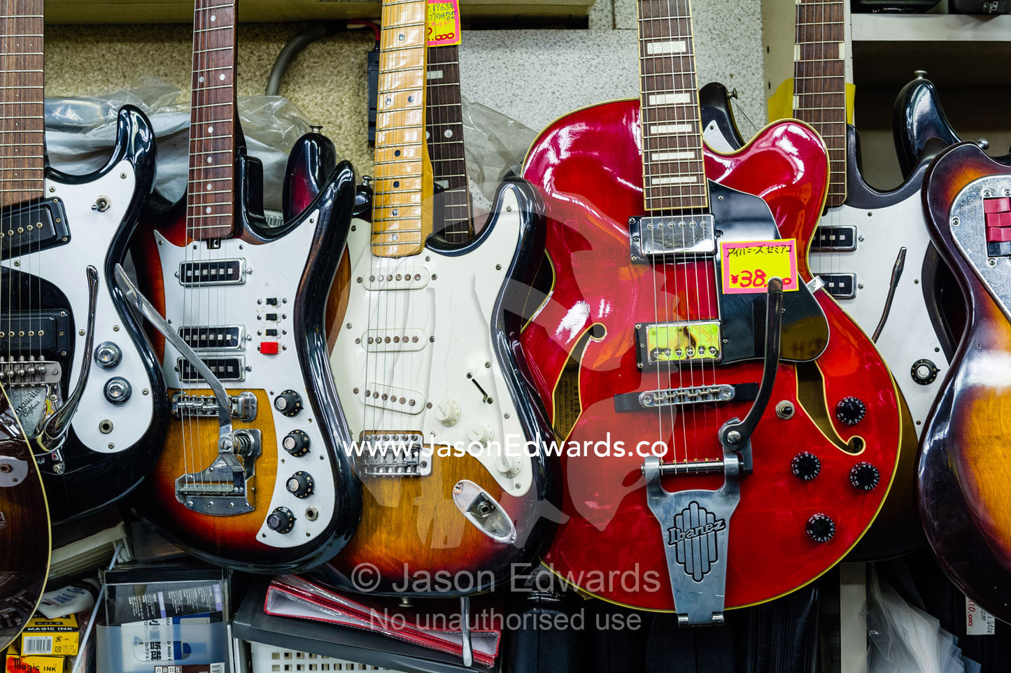Electric guitars for sale in a Japanese music store. Hiroshima, Honshu Island, Japan.