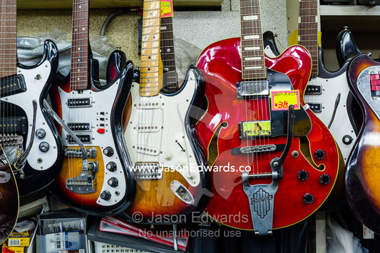 Electric guitars for sale in a Japanese music store. Hiroshima, Honshu Island, Japan.