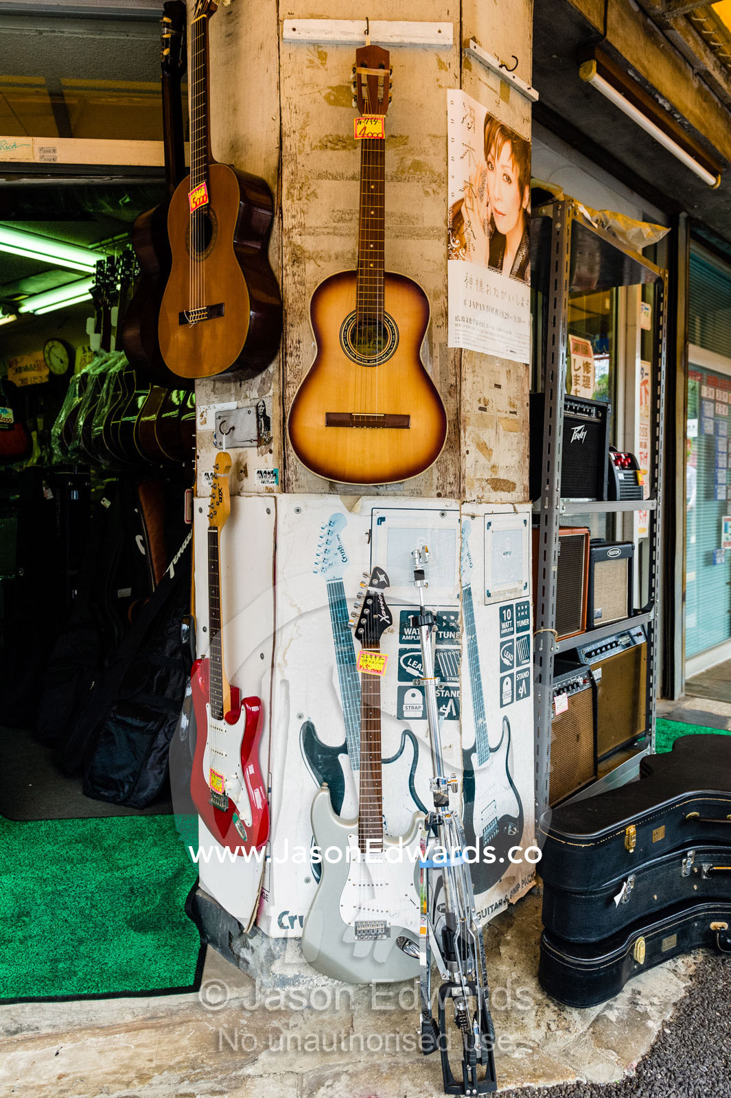 Acoustic guitars for sale in a Japanese music store. Hiroshima, Honshu Island, Japan.