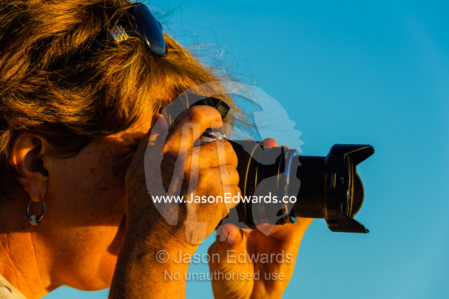 A photographer photographing the dawn. Research Beach, Heron Island, Great Barrier Reef, Queensland, Australia.