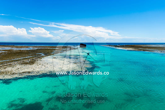 A manmade channel cut through a coral reef to allow boats to access a tropical island. Heron Island Harbour, Heron Island, Great Barrier Reef, Queensland, Australia.