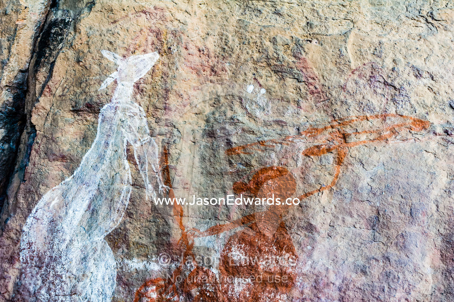 An Aboriginal rock painting art gallery featuring a freshwater period hunter and a kangaroo. Burrunggui, Nourlangie Rock, Arnhem Land, Kakadu National Park, Northern Territory, Australia.