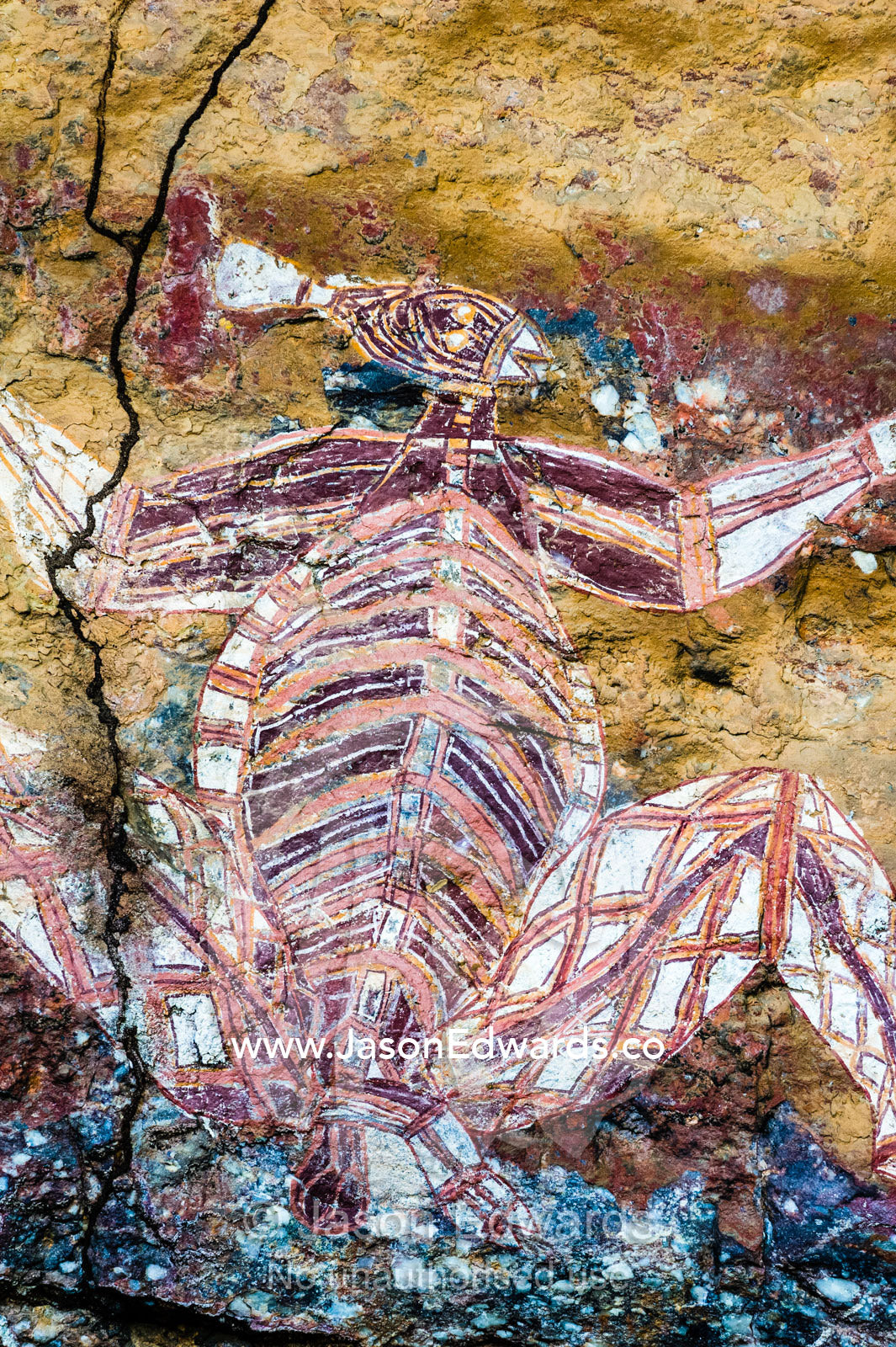 An Aboriginal rock painting art gallery featuring Namarrgon the Lightning Man. Burrunggui, Nourlangie Rock, Arnhem Land, Kakadu National Park, Northern Territory, Australia.