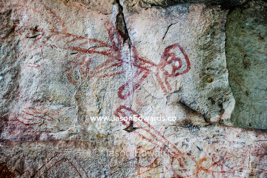 An Aboriginal rock painting art gallery featuring a female figure. Ubirr, Kakadu National Park, Northern Territory, Australia.