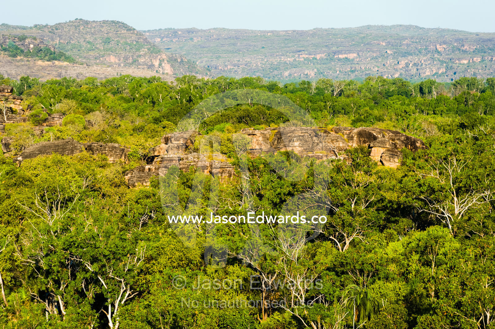 Sunset falls over a rugged Kombilgie sandstone stone country. Ubirr, Kakadu National Park, Northern Territory, Australia.
