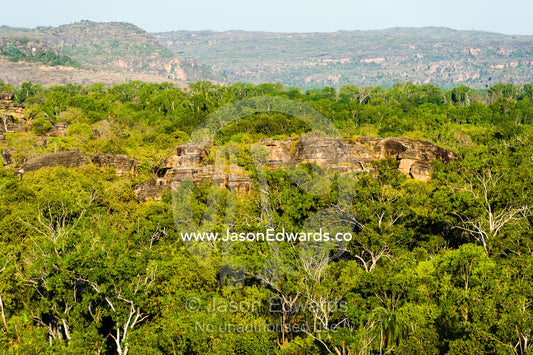 Sunset falls over a rugged Kombilgie sandstone stone country. Ubirr, Kakadu National Park, Northern Territory, Australia.