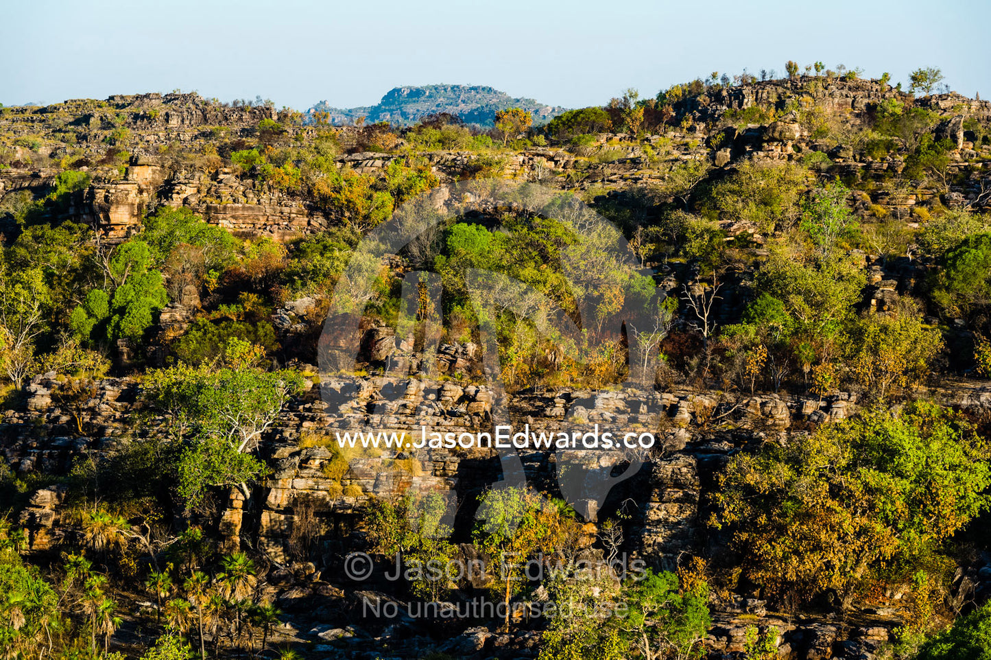 Sunset falls over a rugged Kombilgie sandstone stone country. Ubirr, Kakadu National Park, Northern Territory, Australia.