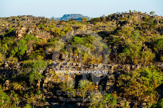 Sunset falls over a rugged Kombilgie sandstone stone country. Ubirr, Kakadu National Park, Northern Territory, Australia.