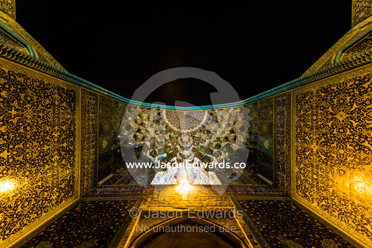 The courtyard and vaulted iwan of the Shah Mosque illuminated at night. Shah Mosque, Isfahan, Isfahan Province, Islamic Republic of Iran.