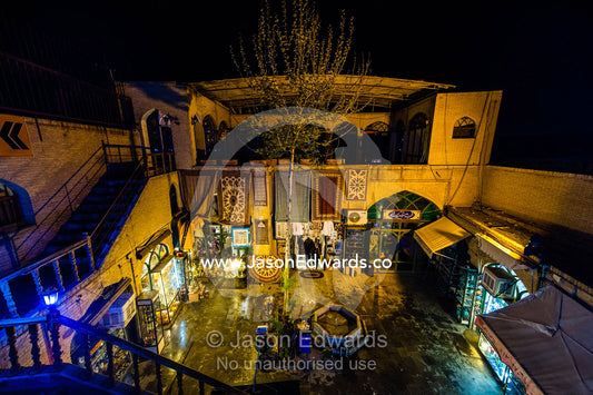 Looking down onto the courtyard of an ancient bazaar and carpet shop. Isfahan Bazaar, Isfahan, Islamic Republic of Iran.