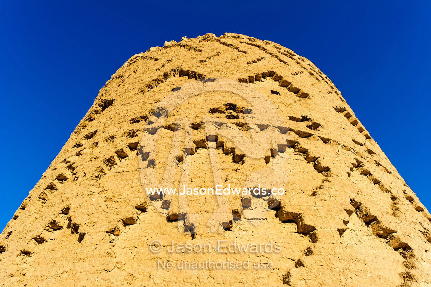An ancient mud brick watch tower in a desert fortress. Narin Castle, Meybod, Meybod County, Yazd Province, Islamic Republic of Iran.