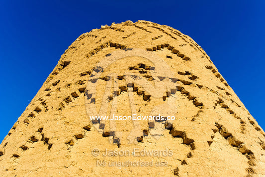 An ancient mud brick watch tower in a desert fortress. Narin Castle, Meybod, Meybod County, Yazd Province, Islamic Republic of Iran.